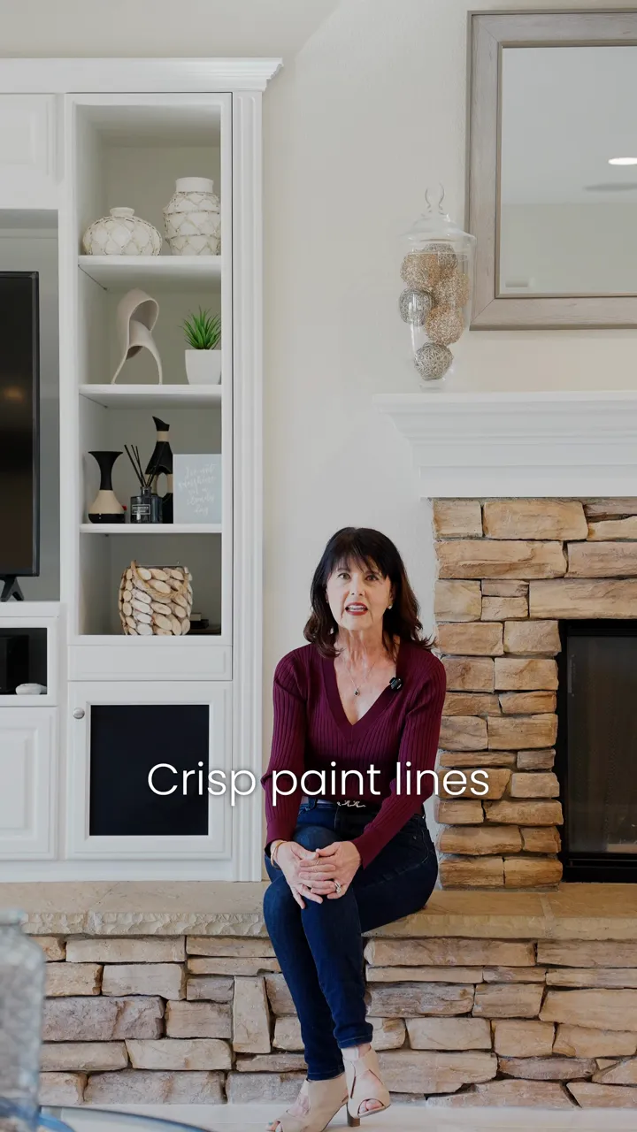 An agent filmed in a kitchen and living room for a video on small upgrades