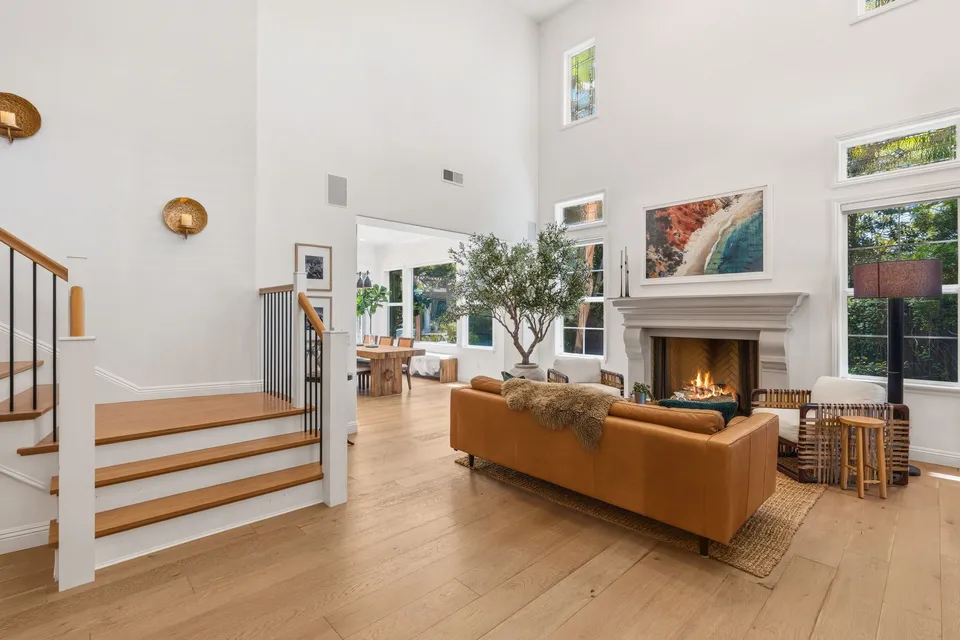 Two-story living room with a fireplace