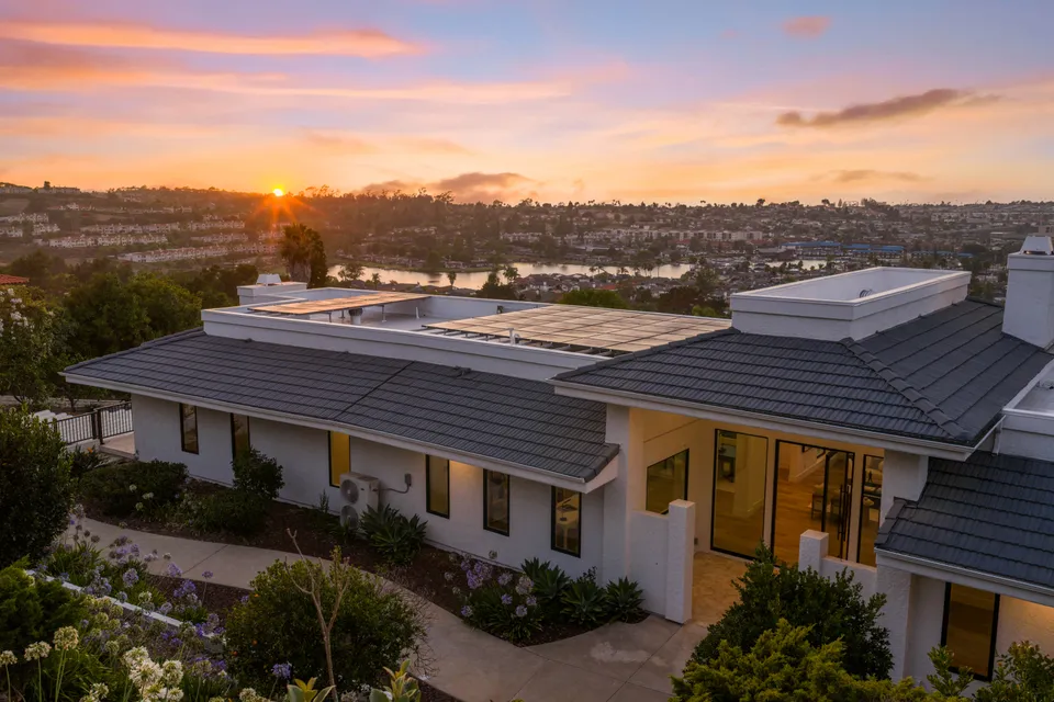 Aerial photo of the home above Lake San Marcos at sunset
