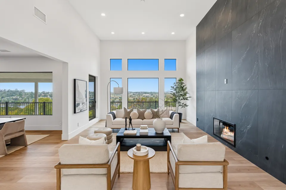 Living room with a black stone fireplace wall
