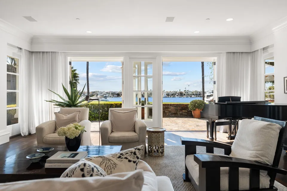 Sitting room open to a terrace on the bay