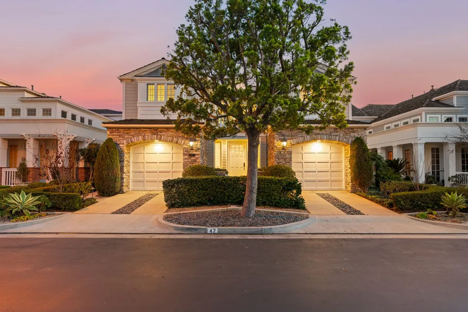 Front of the home and garage at dusk
