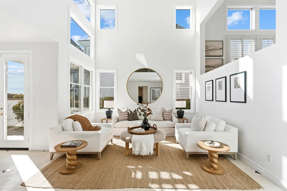Two-story living room with tall windows
