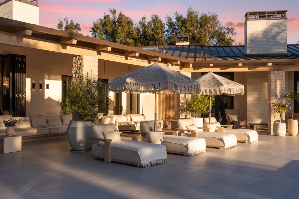 Covered terrace with lounge seating and umbrellas