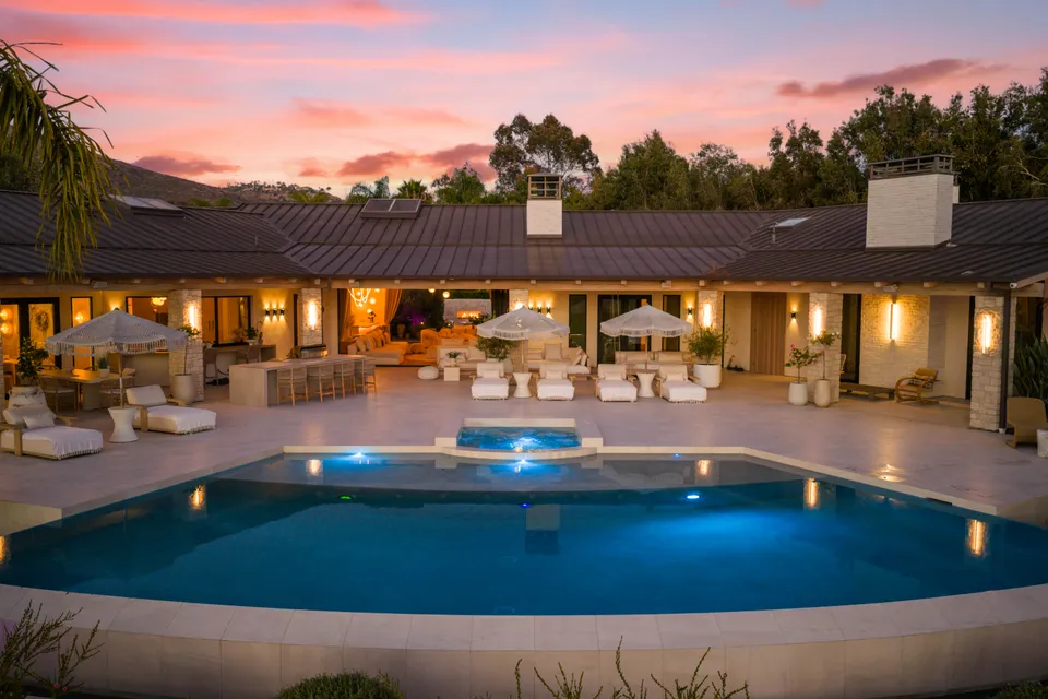 Pool and home lit at night