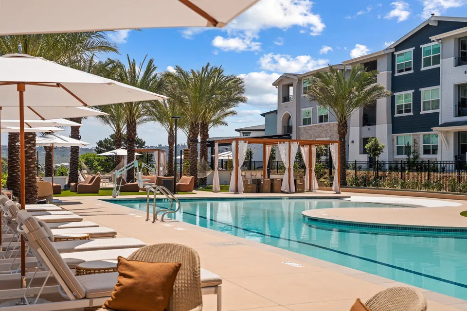 Pool deck with cabanas and lounge chairs